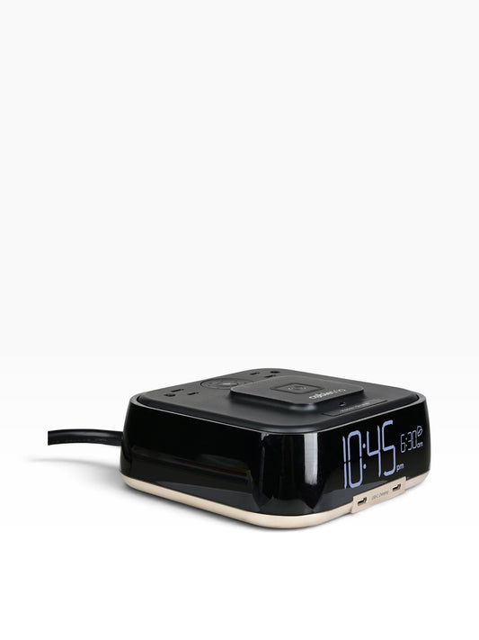 Valiant Products CubieTrio black alarm clock with wireless charging pad, USB-C ports, and power outlets on a white background