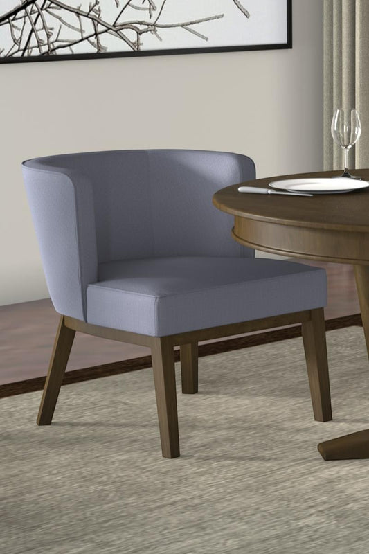 Valiant Products Langford accent chair in grey linen with a curved back and sturdy wooden legs at a dining table
