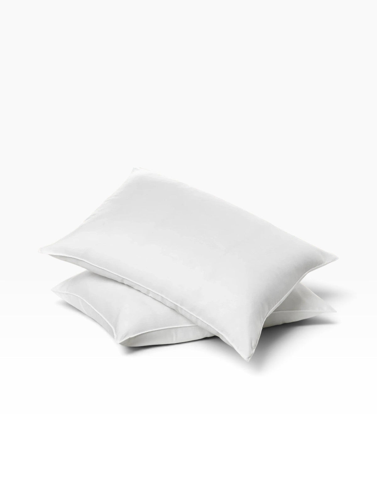 Two white Valiant Products Ultra Touch standard pillows stacked on a plain white background.