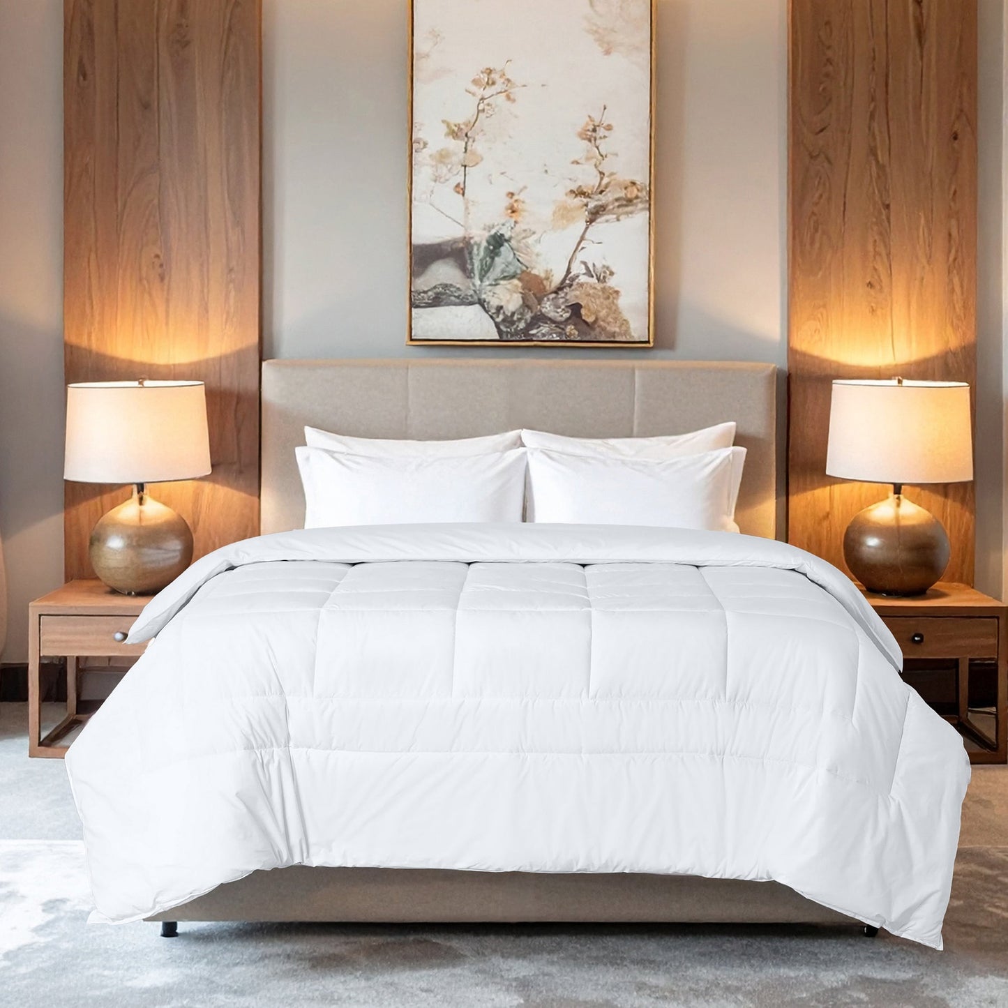 Valiant Products white quilted down alternative comforter on a bed in a modern hotel-style bedroom.