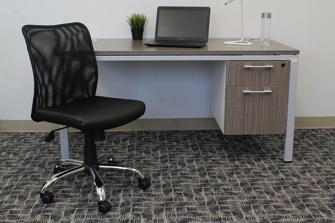 Valiant Products Walter armless ergonomic office chair with black mesh back and vinyl seat on a chrome base.
