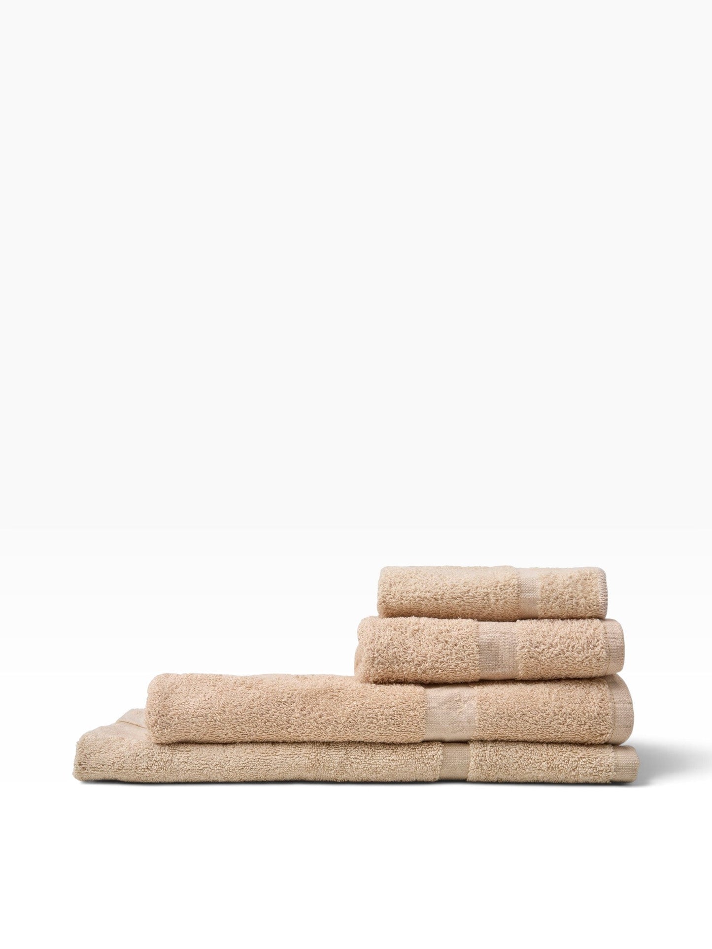 Valiant Products Unity CAM Border bath mats in beige, featuring a durable cotton blend and elegant cam border design.
