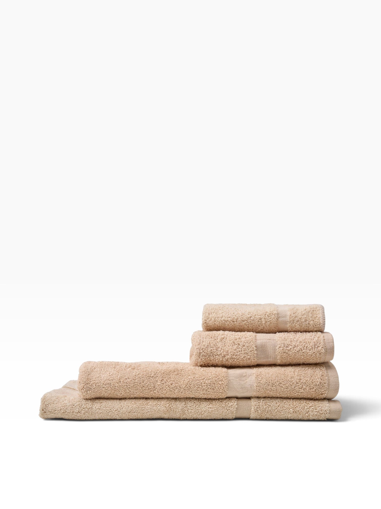 Valiant Products beige cotton-blend wash cloths with classic CAM border design stacked neatly on a white background.