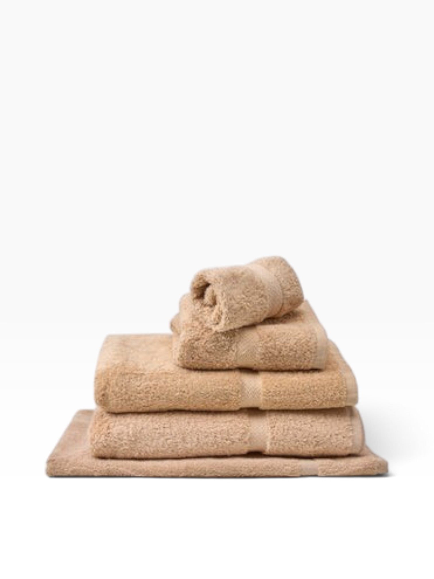Valiant Products Royal Suite beige cotton blend bath towels stacked with elegant dobby border detail