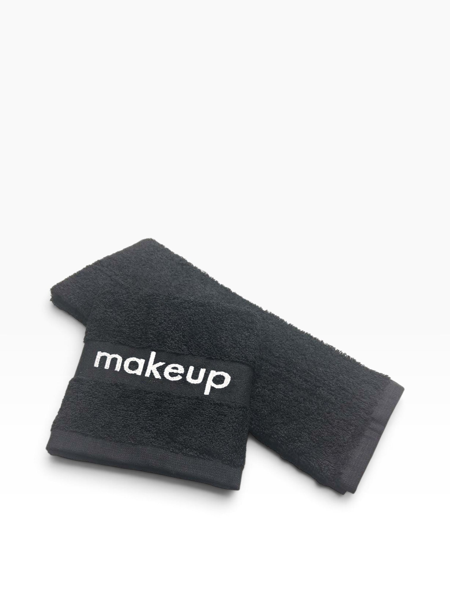 Valiant Products black cotton washcloth with a grey jacquard border featuring the word makeup for guest room use.