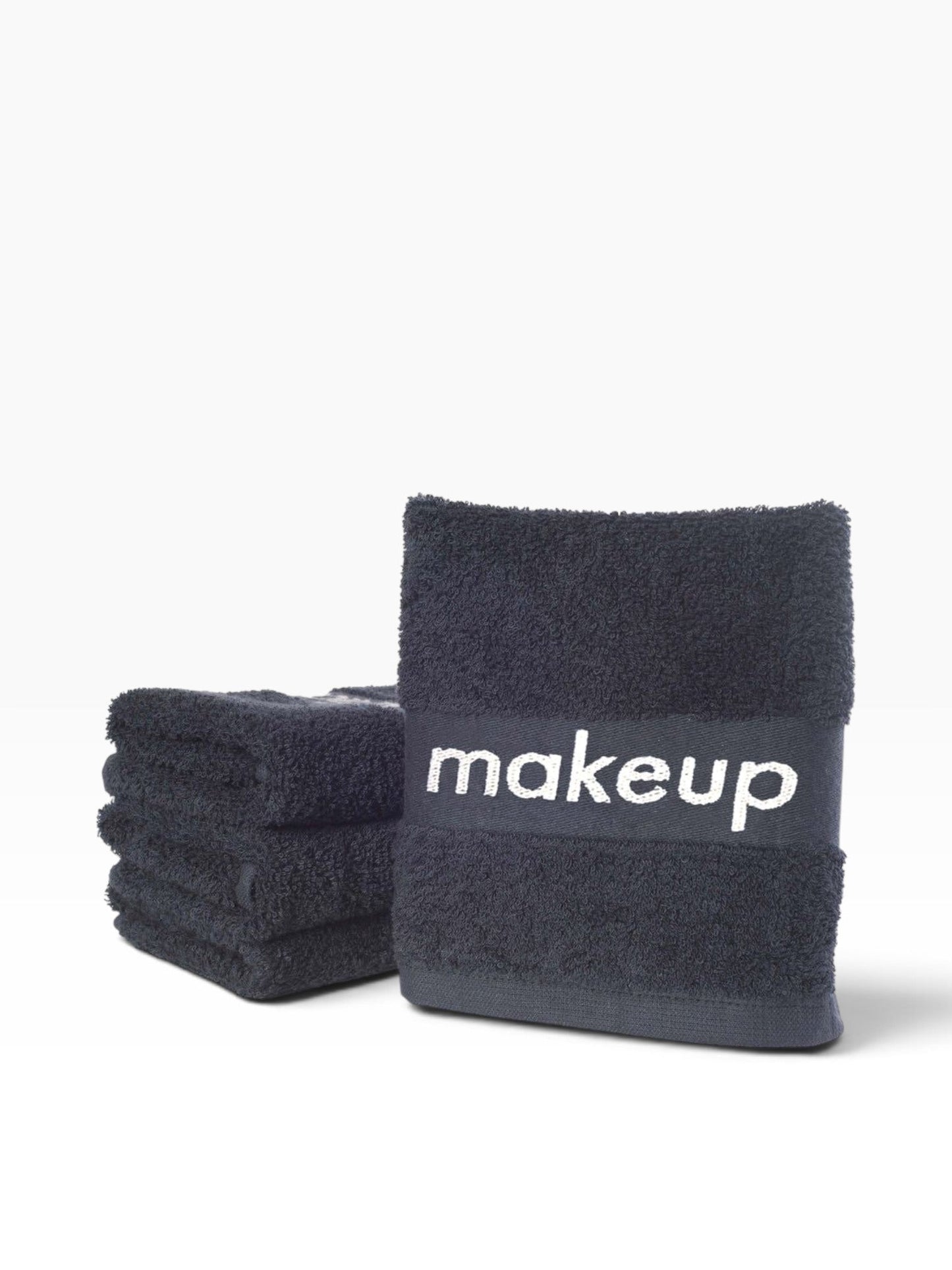 Valiant Products black cotton washcloths with a grey jacquard border featuring the word makeup for guest rooms.