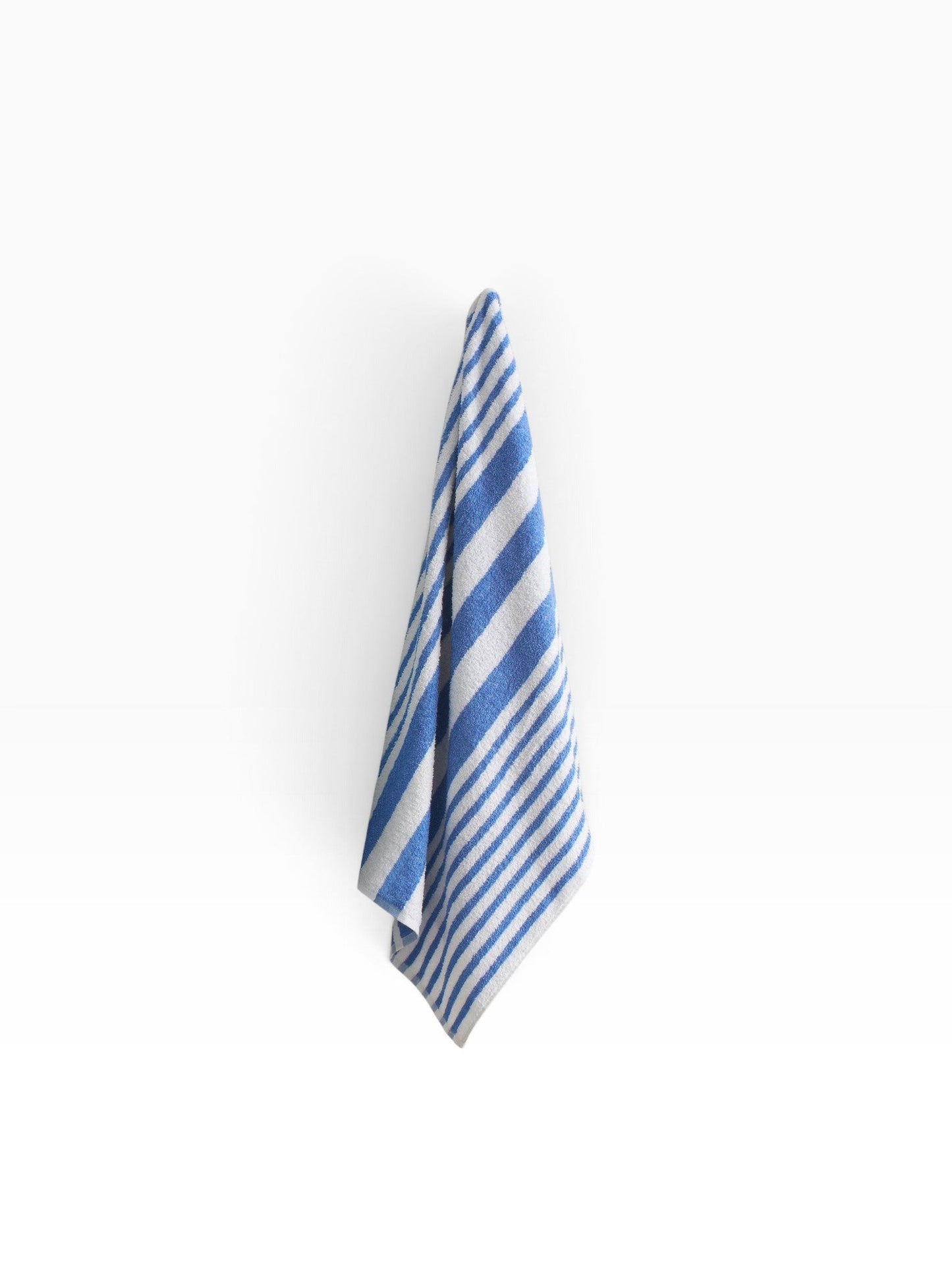 Valiant Products Topical Stripe pool towel in white with blue stripes, made from soft 100% cotton for hospitality use.