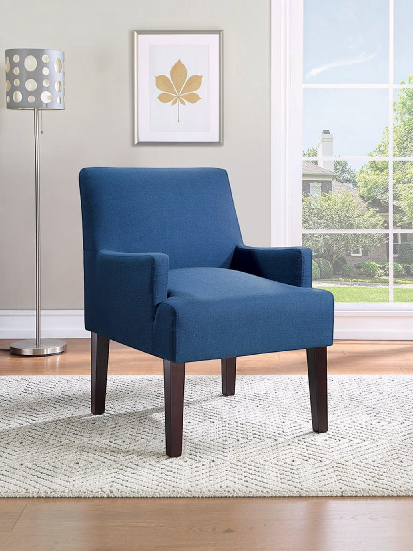 Valiant Products Bombo lounge chair in indigo fabric with espresso wooden legs in a bright living room setting