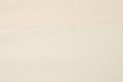 Valiant Products bone colored T-200 thread count flat sheet with durable stitching and a crisp percale weave