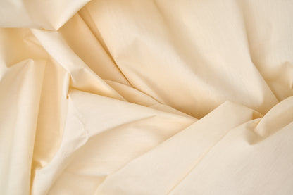 Valiant Products bone-colored T-200 thread count cotton-polyester blend flat sheet with a crisp percale weave