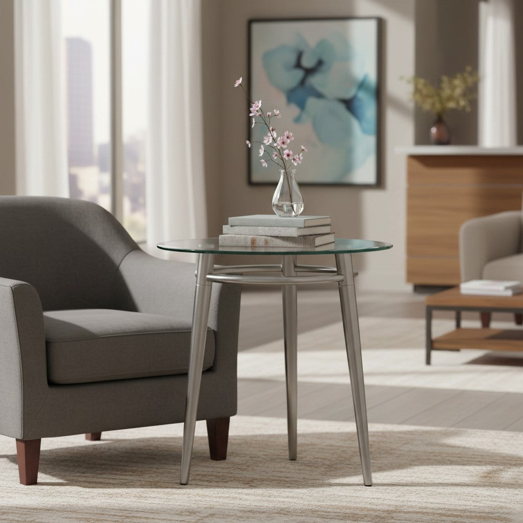 Valiant Products Brooklyn round end table with a clear glass top and brushed nickel metal legs in a living room
