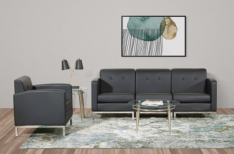 Valiant Products Brooklyn round glass end table with brushed nickel legs in a modern living room setting
