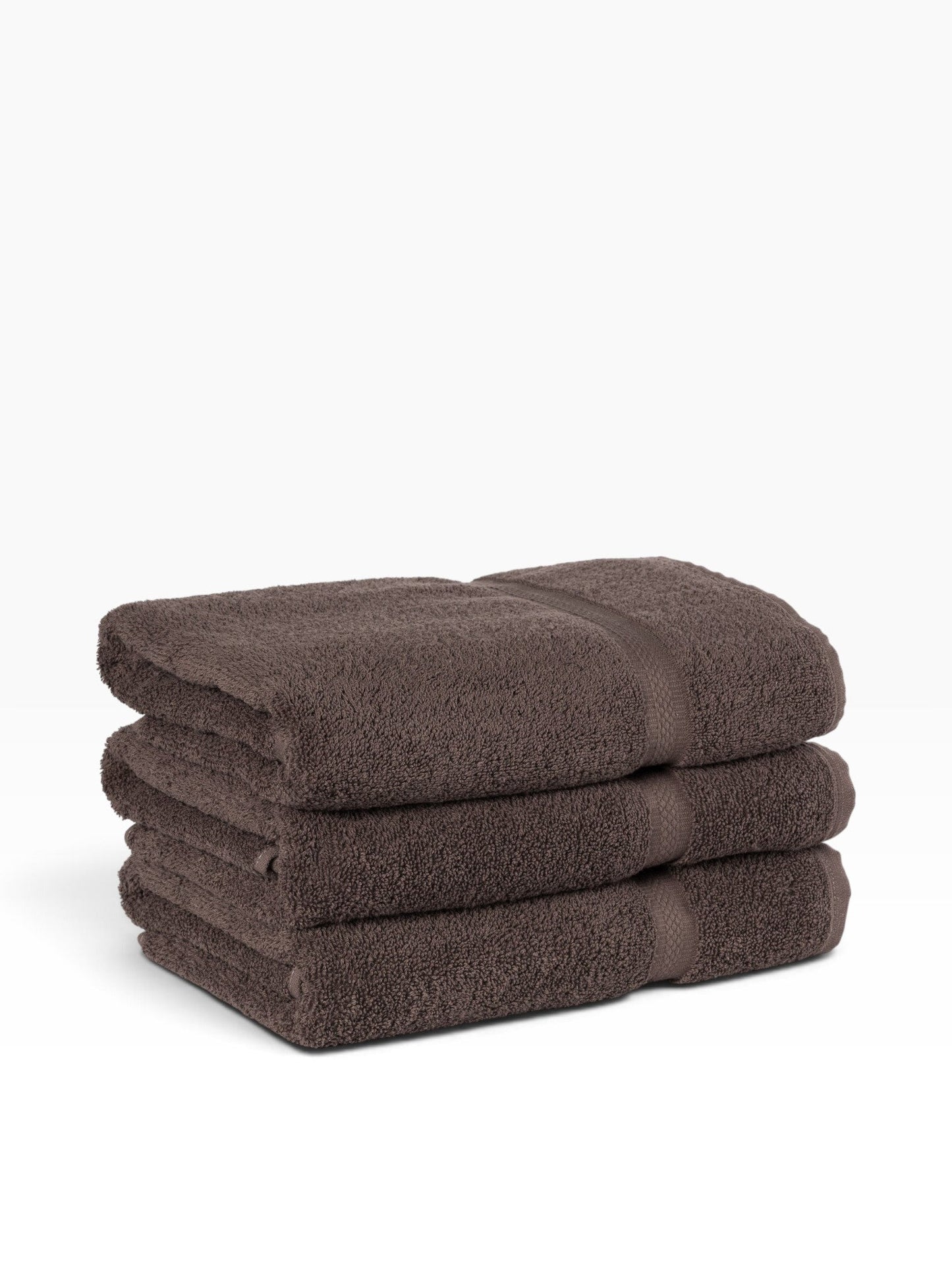 Valiant Products brown ring-spun cotton hand towels with a decorative dobby border, stacked in a set of three.