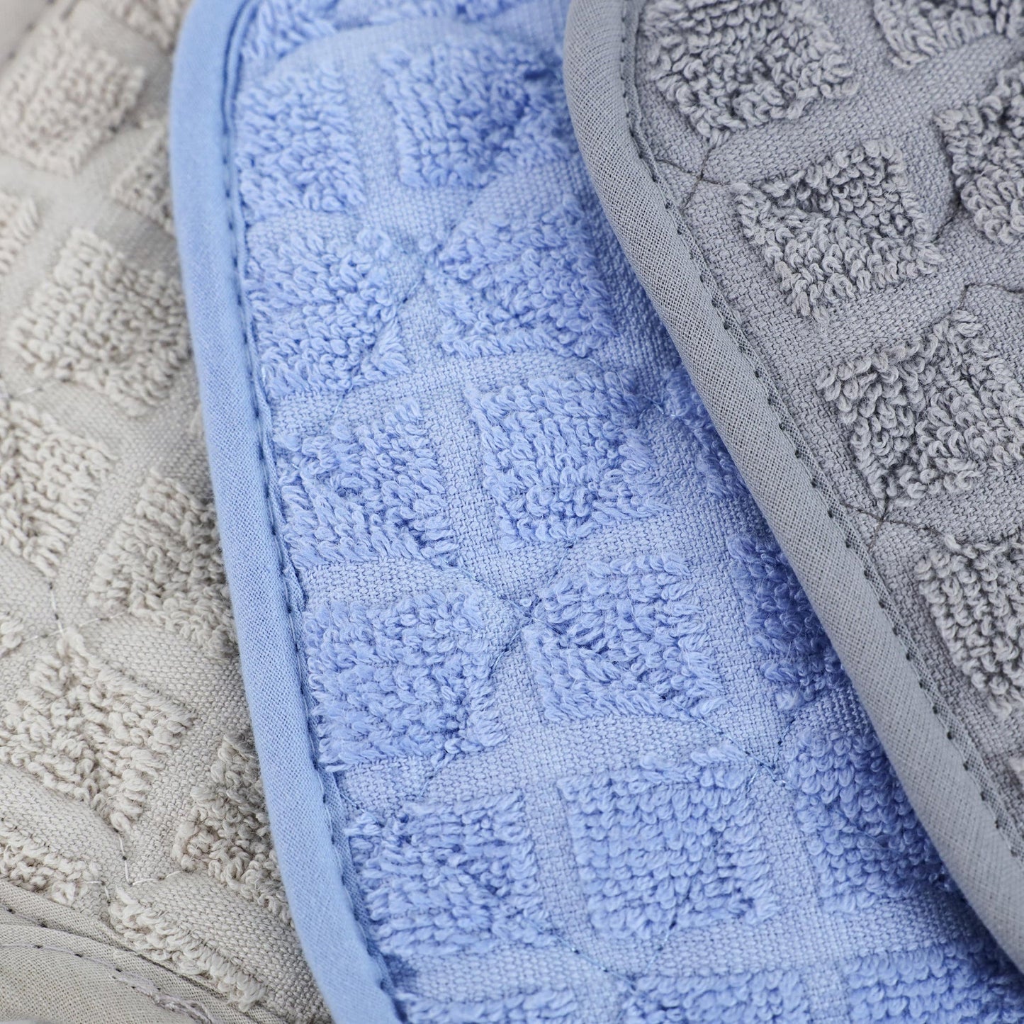 Valiant Products fade-resistant cotton pot holders in blue, grey, and khaki with a textured square pattern