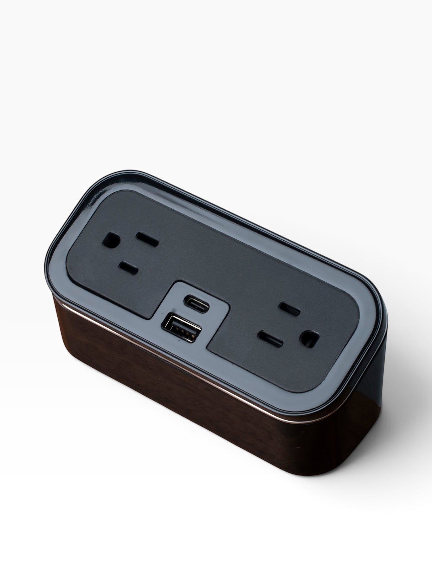 Valiant Products CubieMini black charging block with two power outlets, USB-A, and USB-C ports for hotel nightstands.