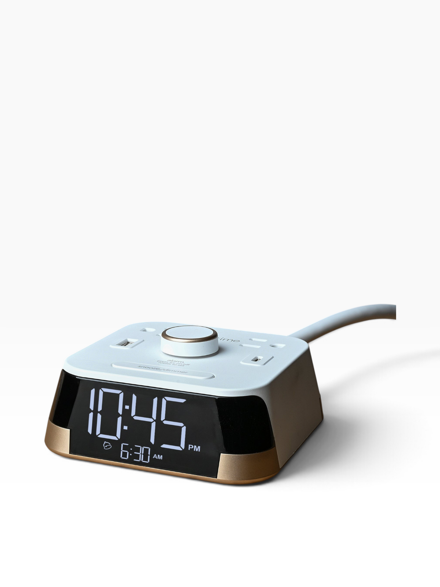 Valiant Products CubieTime white and gold hotel alarm clock with USB-C, USB-A ports, and power outlets on a white background