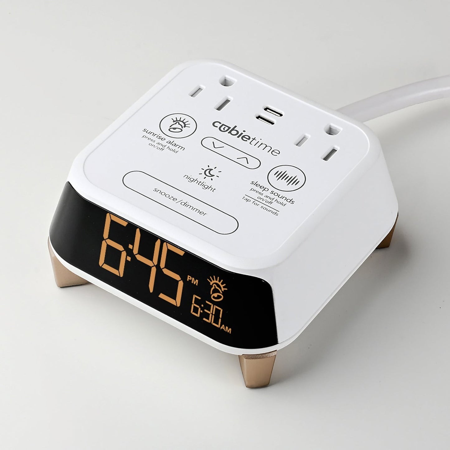 Valiant Products CubieTime Zen white alarm clock with USB ports, power outlets, and a digital display on a light surface