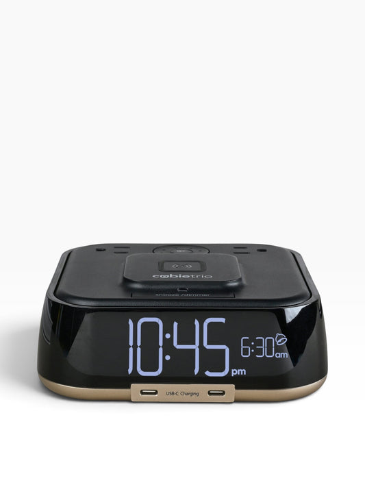Valiant Products CubieTrio black hotel alarm clock with wireless charging pad, digital display, and two USB-C ports.