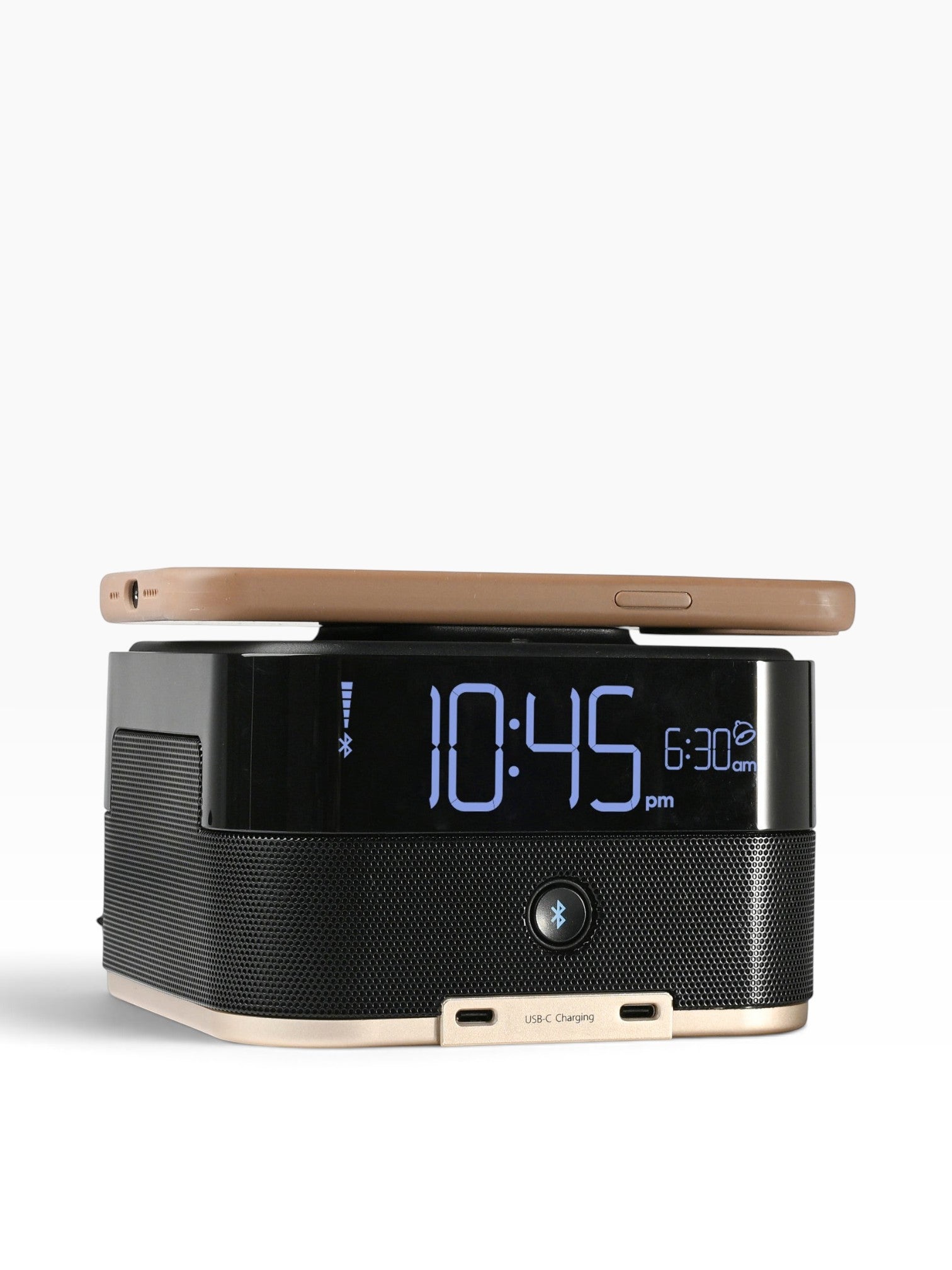 Valiant Products CubieTrio+ black alarm clock with Bluetooth speaker, USB-C ports, and wireless phone charging.