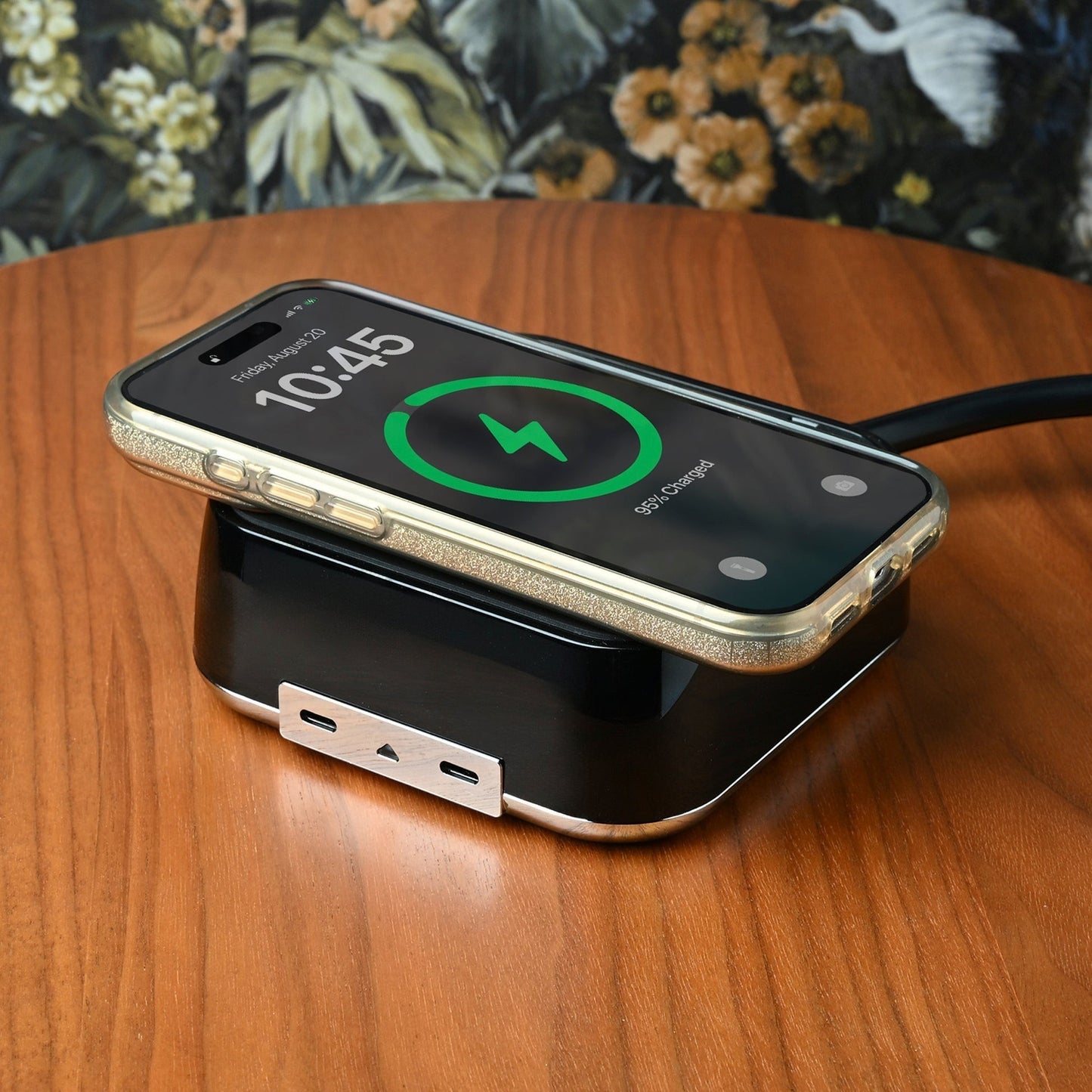 Valiant Products CubieVia black charging block with wireless phone charger and USB-C ports on a wooden nightstand