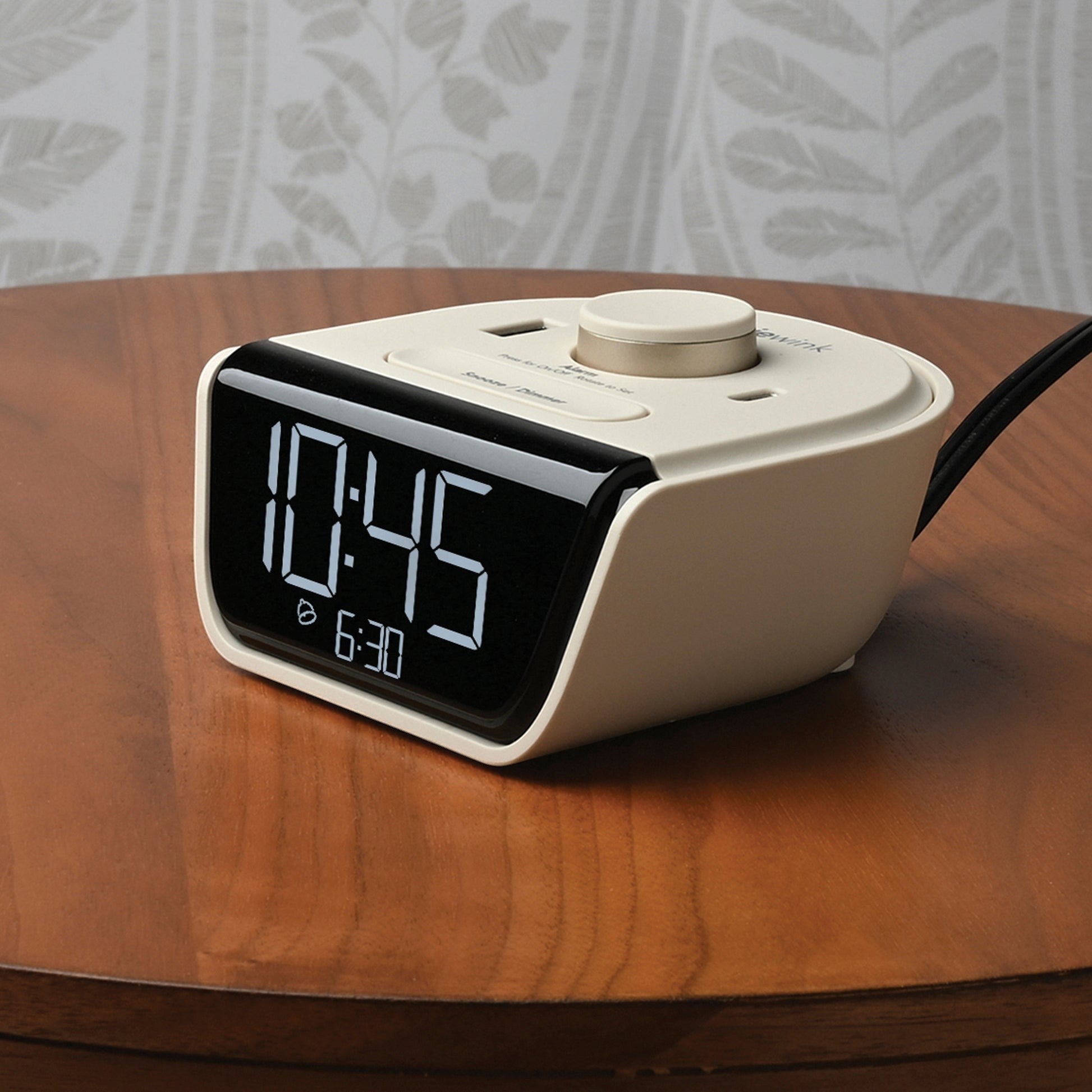 Valiant Products CubieWink latte alarm clock with digital display and USB charging ports on a wooden nightstand