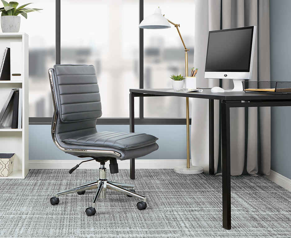 Valiant Products Dione Ergo Chair in grey faux leather with chrome base and lumbar support in a modern home office.