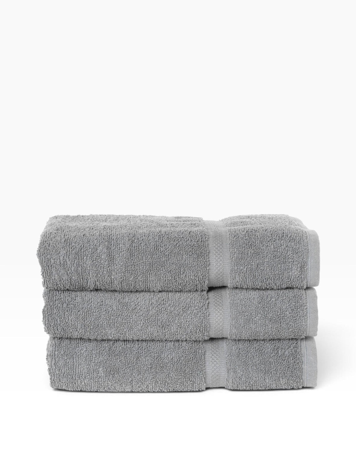 Valiant Products gray dobby border bath towels stacked neatly against a white background
