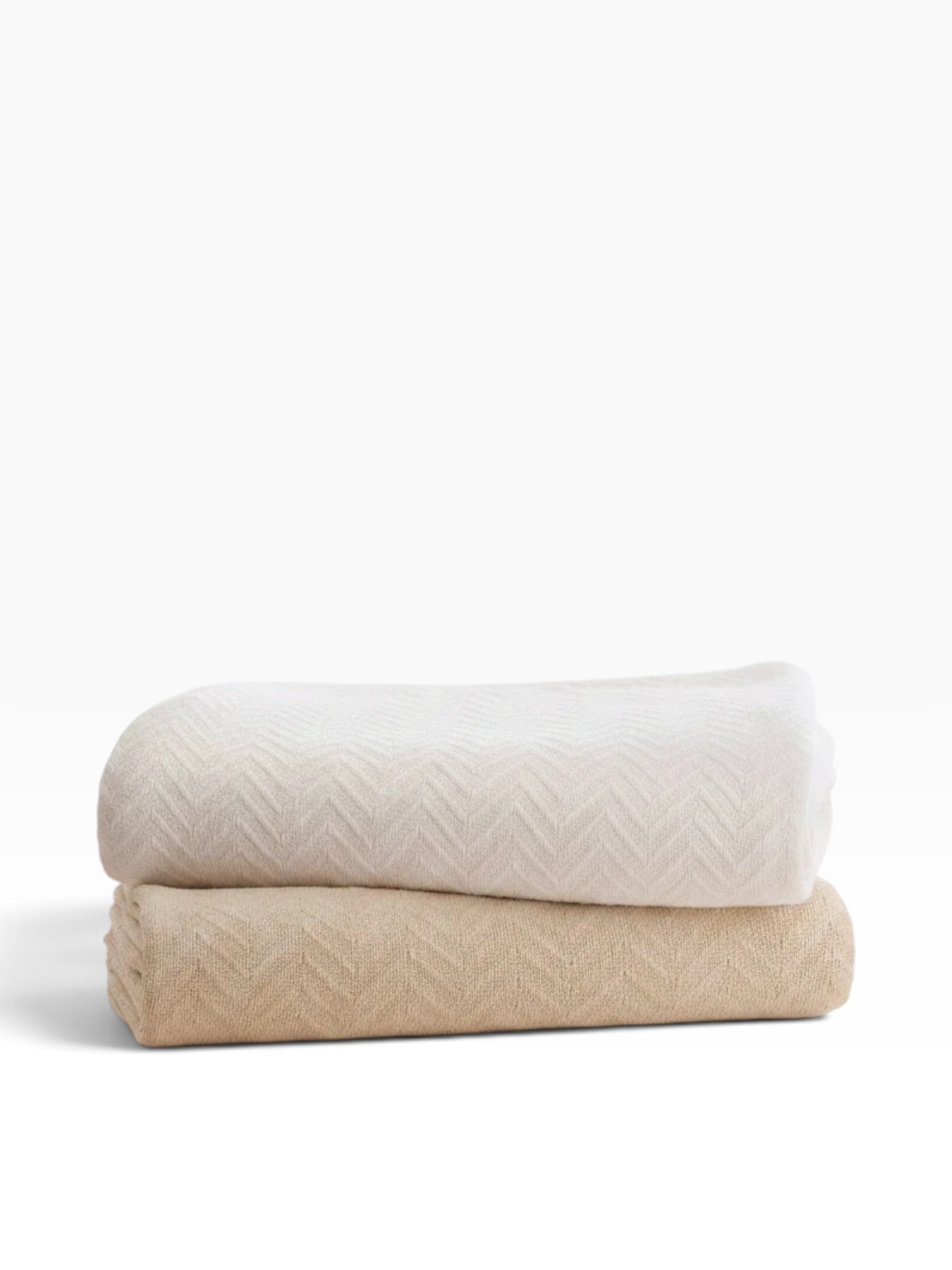 Valiant Products Grand Patrician 100% cotton blankets in white and natural with a classic herringbone weave pattern.