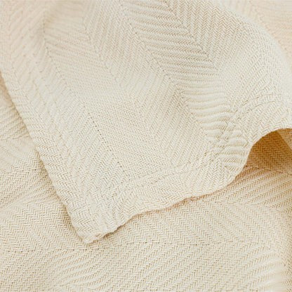 Valiant Products Martex Atelier Luxe blanket in natural with a detailed herringbone weave texture.
