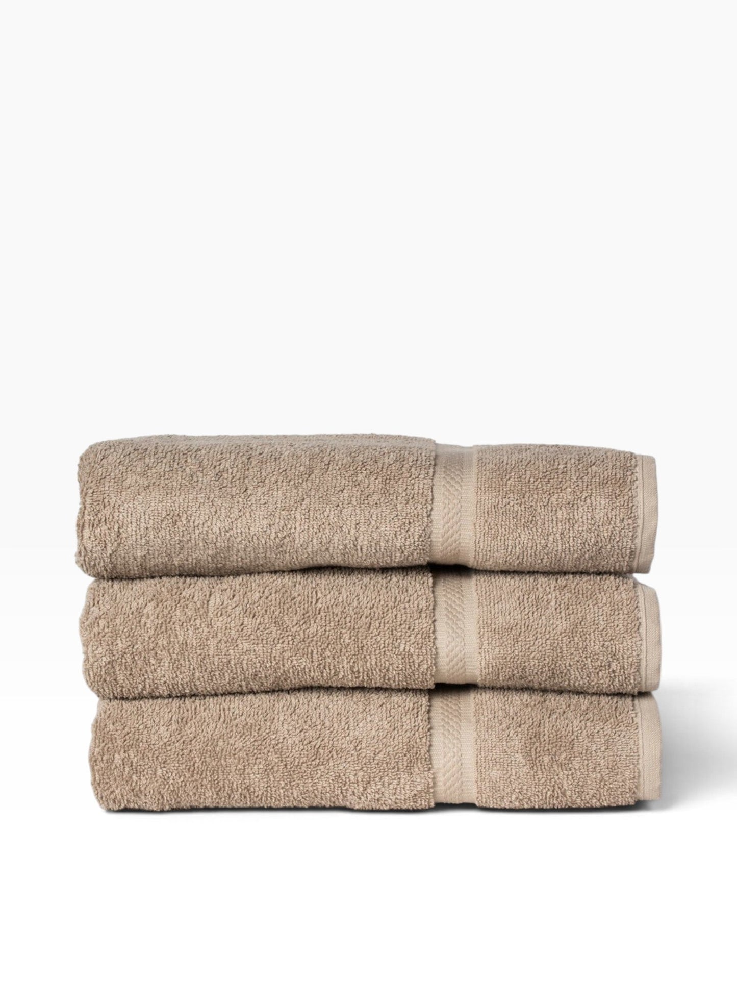 Valiant Products khaki ring-spun cotton bath towels stacked with a decorative dobby border design.