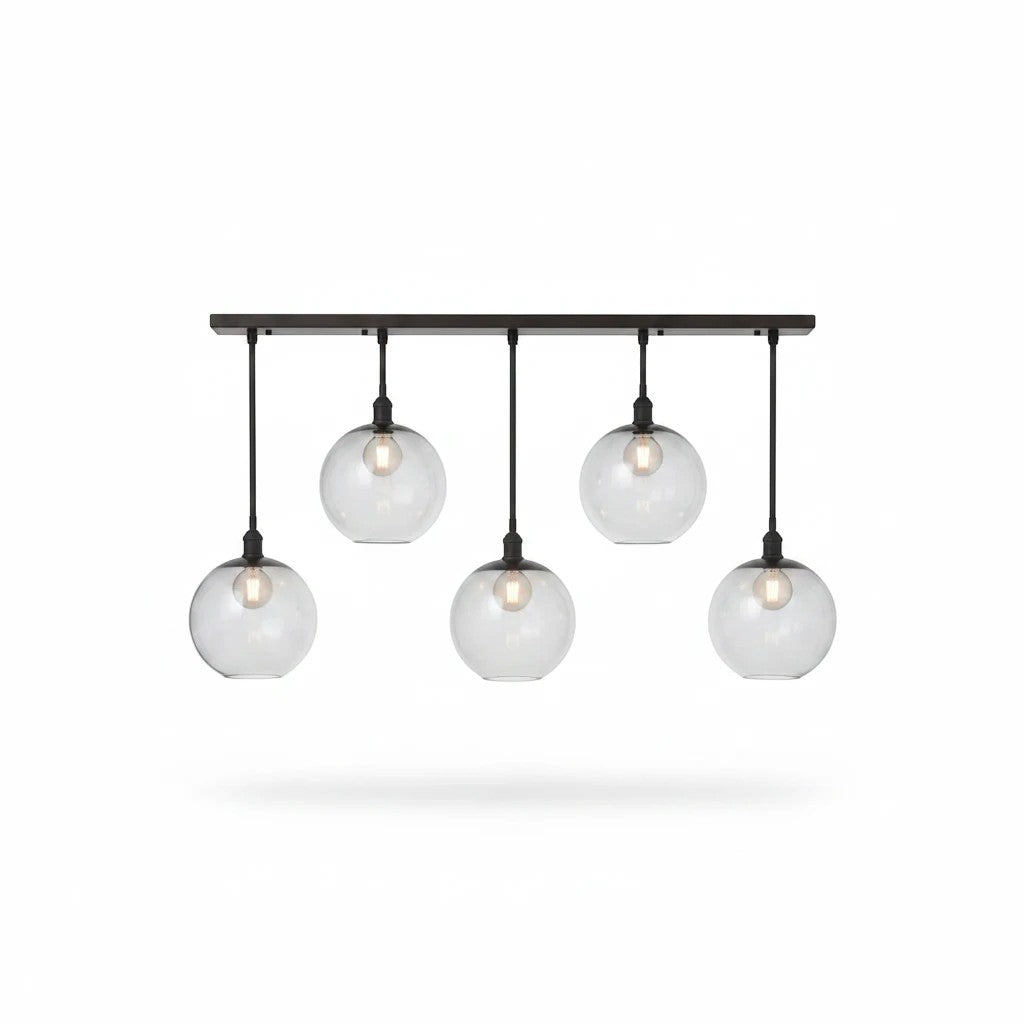 Valiant Products Luma 5-globe pendant light with bronze finish and smoked grey glass shades in a linear arrangement.