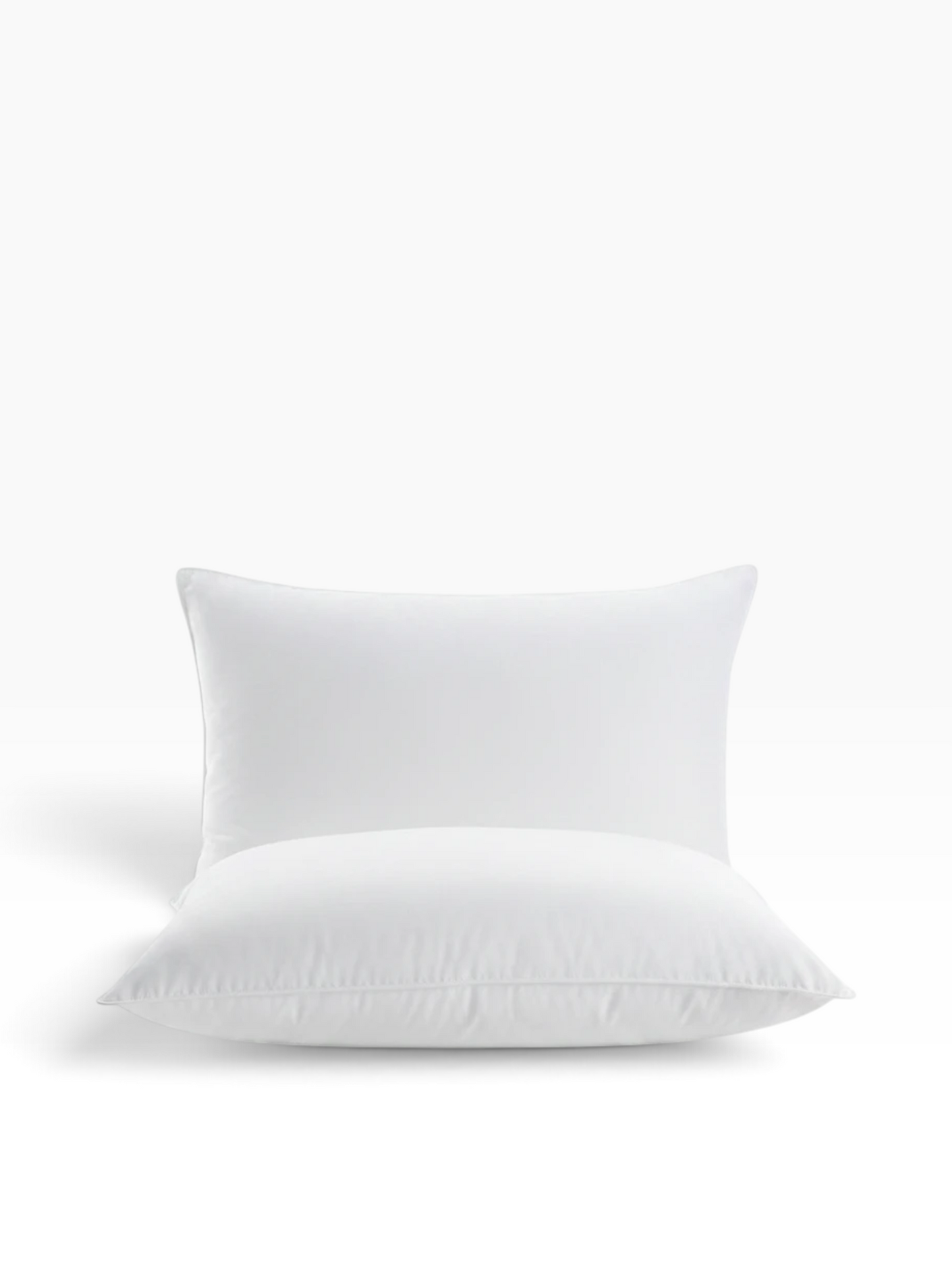 Valiant Products Martex Basics white hospitality pillow with EcoPure recycled fiberfill and durable overlock stitching.