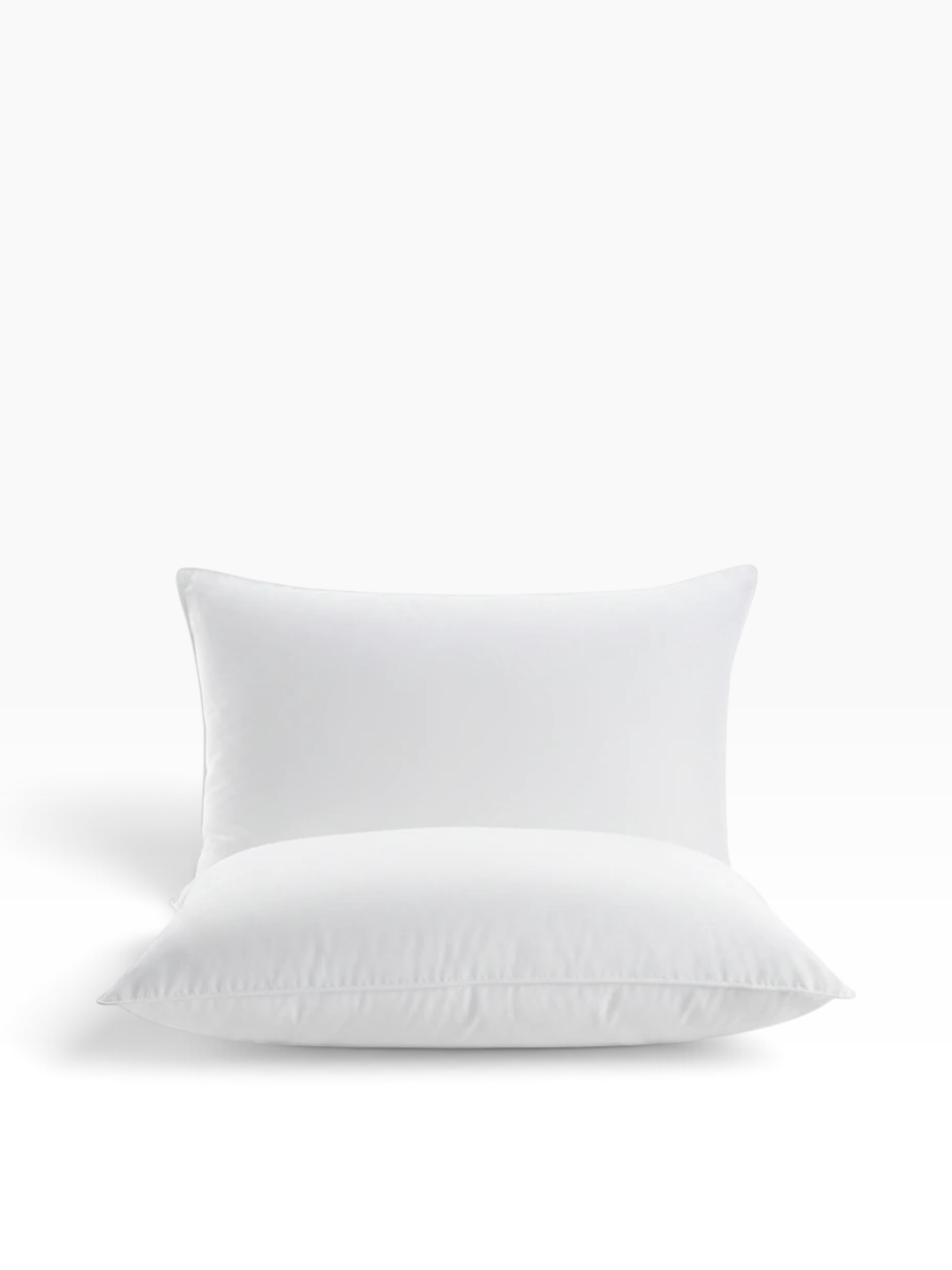 Valiant Products Martex Basics white hospitality pillow with EcoPure recycled fiberfill and durable overlock stitching.
