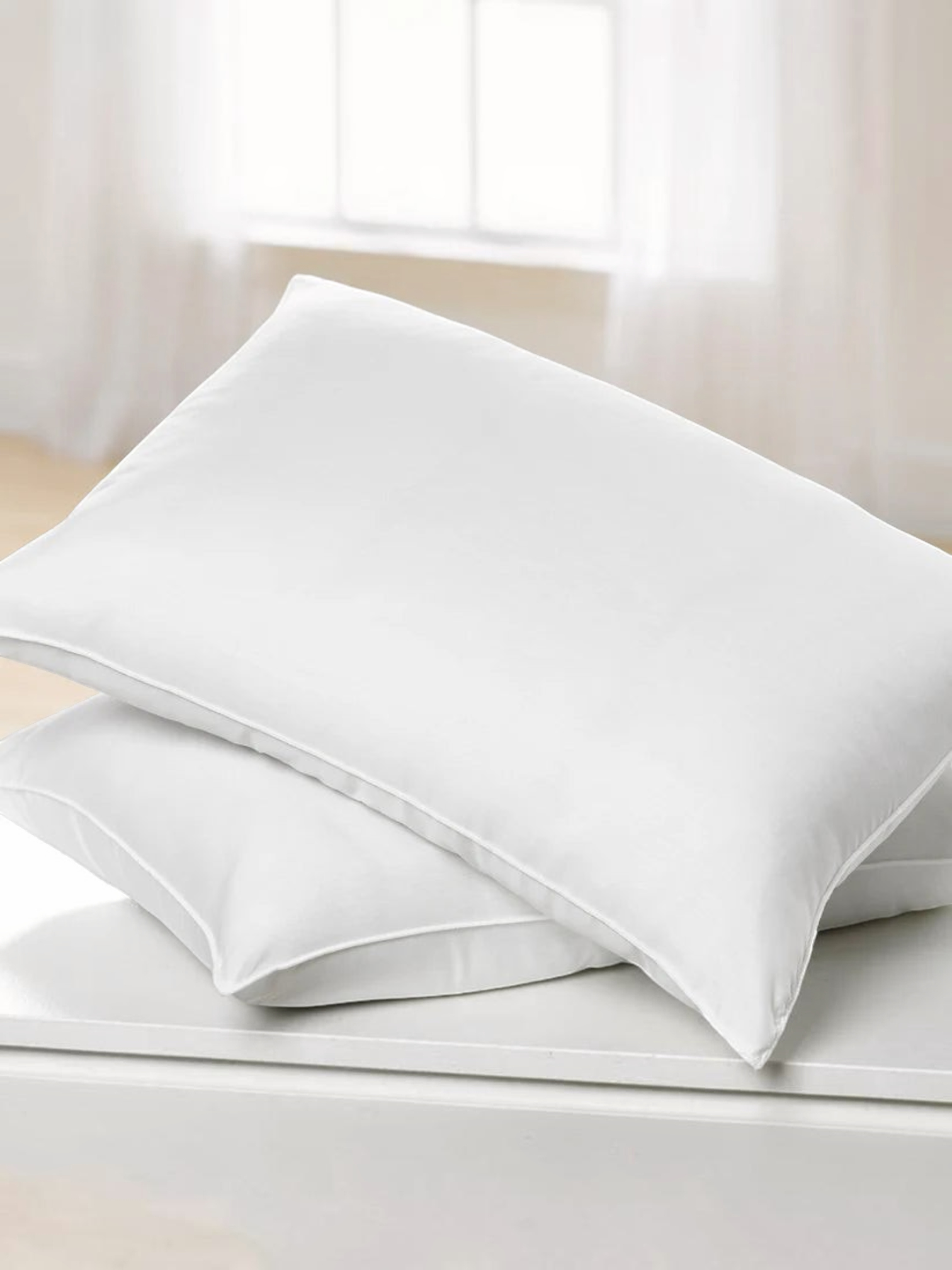 Valiant Products Martex Basics white hospitality pillow with durable overlock stitching and soft recycled fiberfill.