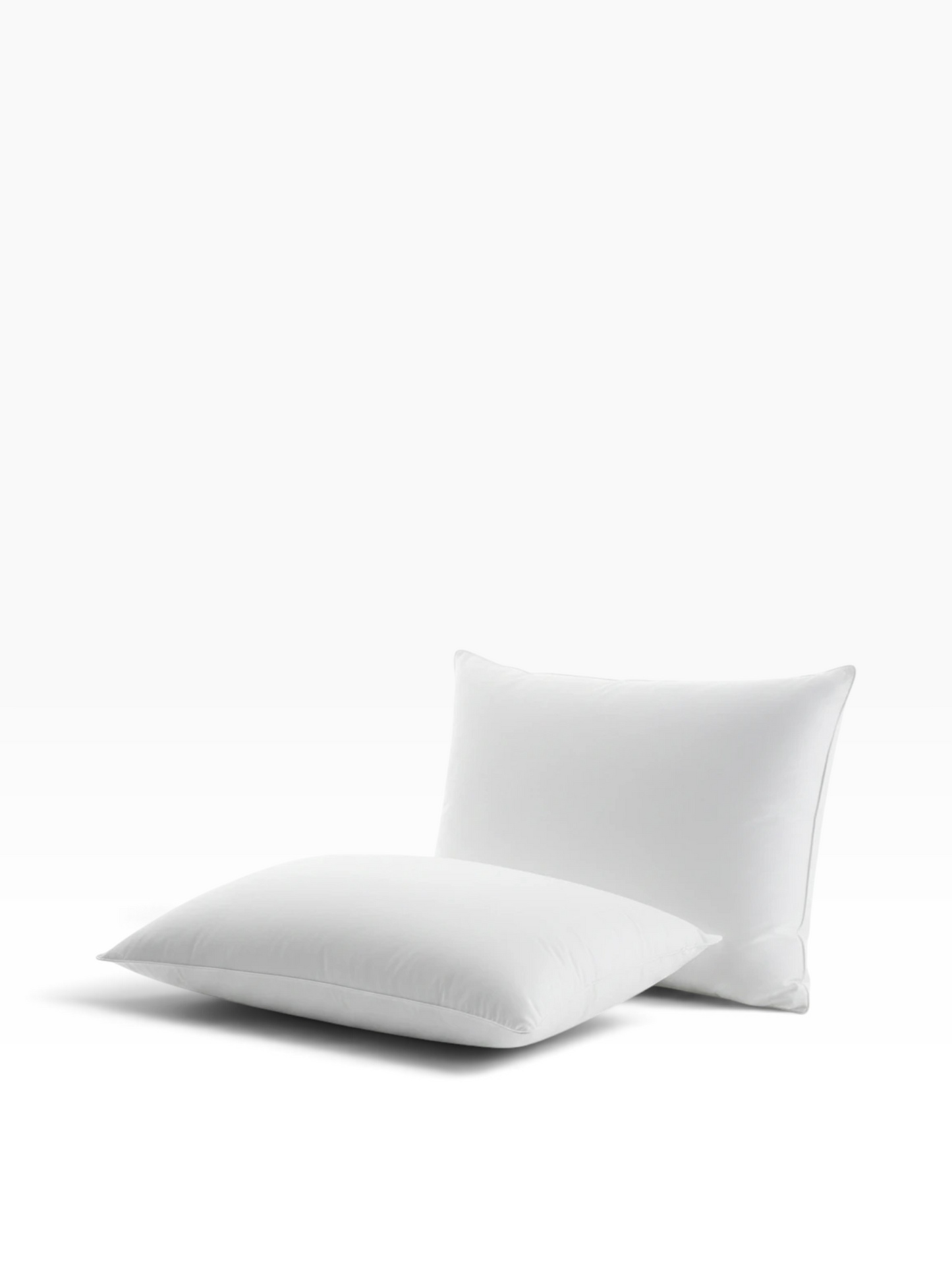 Valiant Products Martex Basics white hospitality pillow with EcoPure recycled fiberfill and durable overlock stitching.