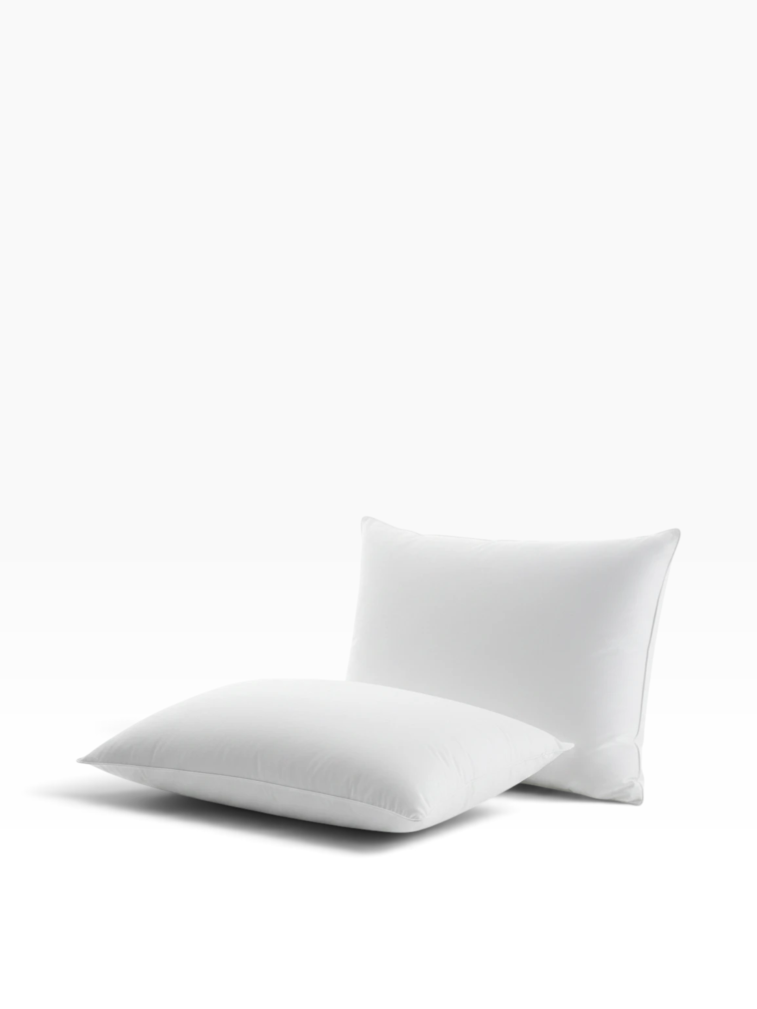 Valiant Products Martex Basics white hospitality pillow with EcoPure recycled fiberfill and durable overlock stitching.
