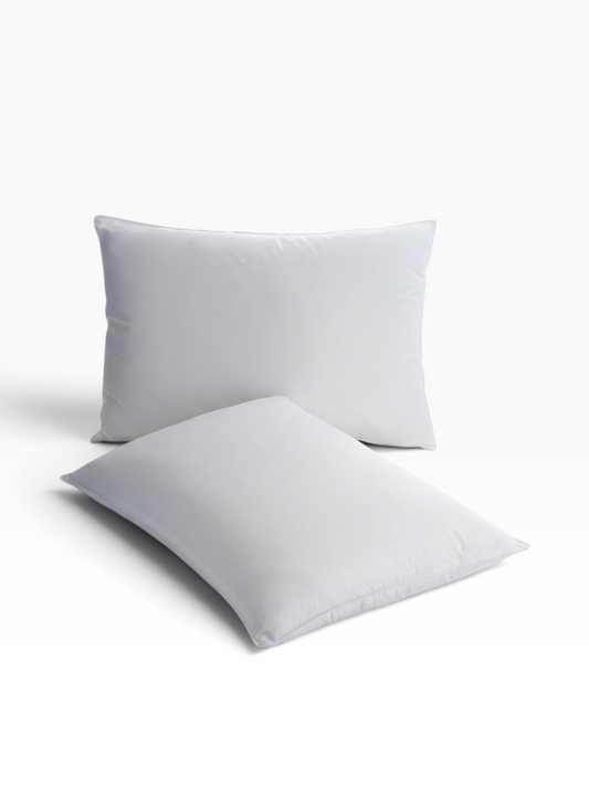 Two white Martex Basics Pillows from Valiant Products with a smooth cotton-polyester blend cover.
