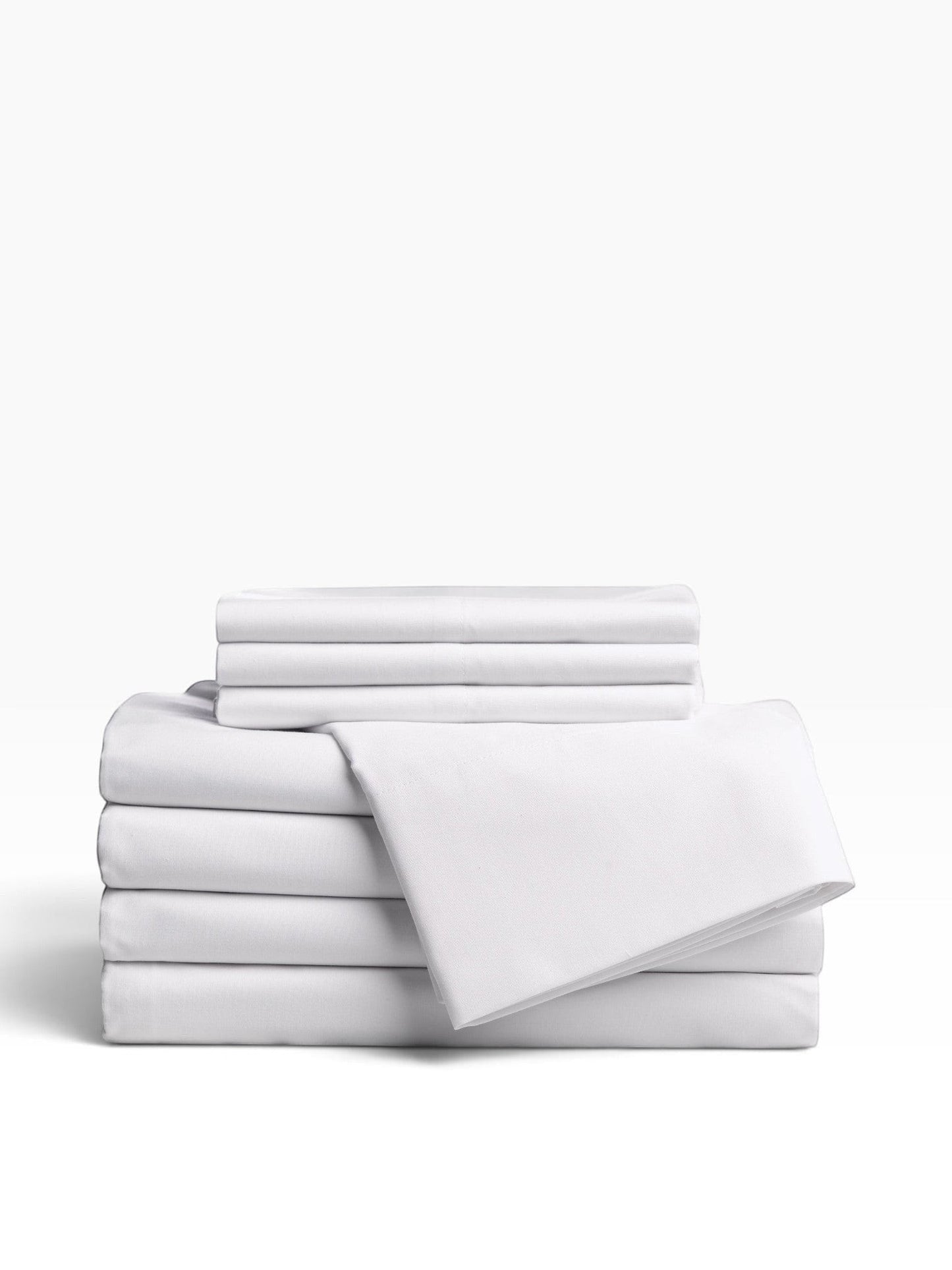 Valiant Products Millennium 300 thread count white cotton-blend flat sheets neatly folded in a stack.