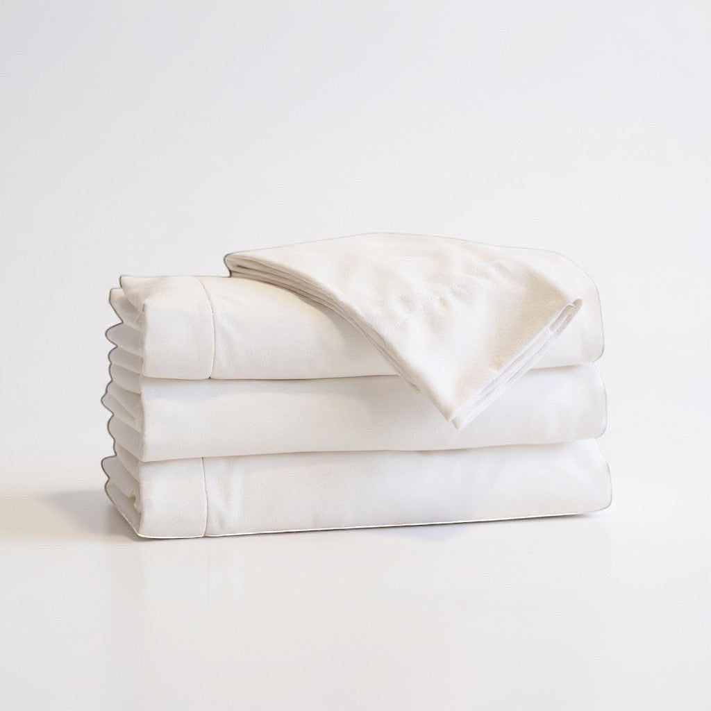 Valiant Products Millennium 300 thread count white flat sheets folded in a neat stack with crisp percale texture.