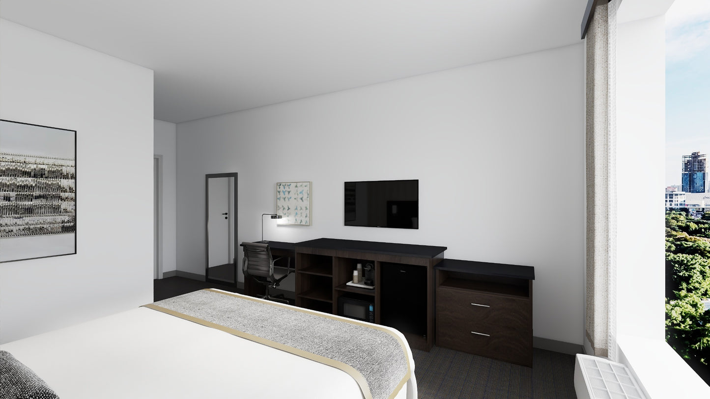 Valiant Products panel desk with black top and wood grain finish in a modern hotel room setting