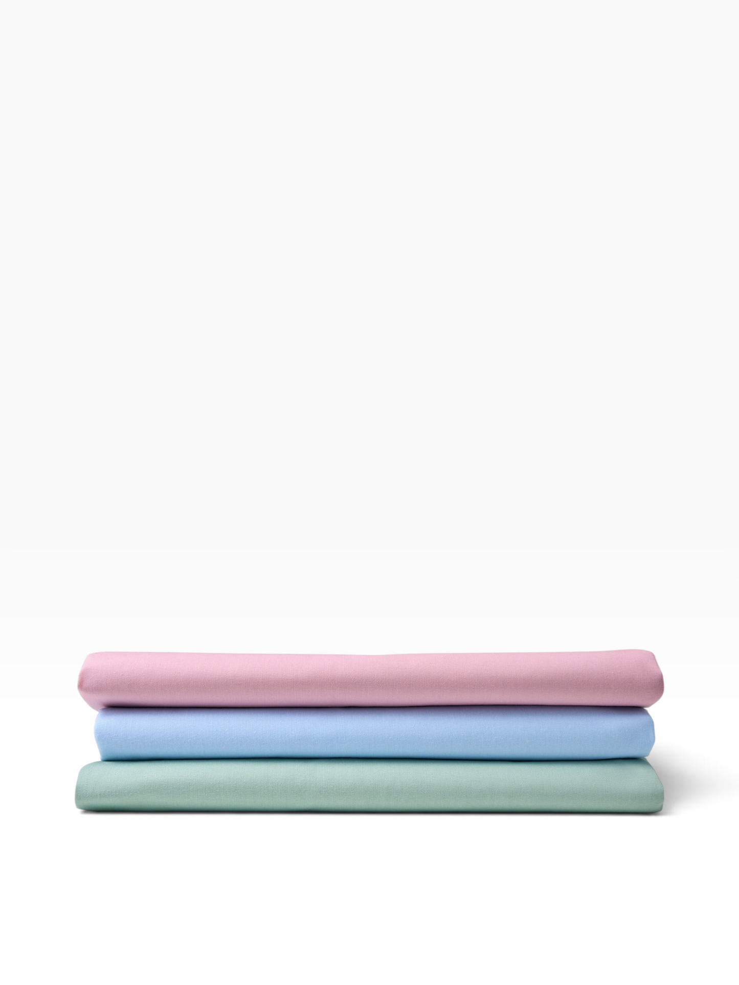 Valiant Products Val Cale 180 thread count cotton-polyester flat sheets in rose, light blue, and seafoam green.