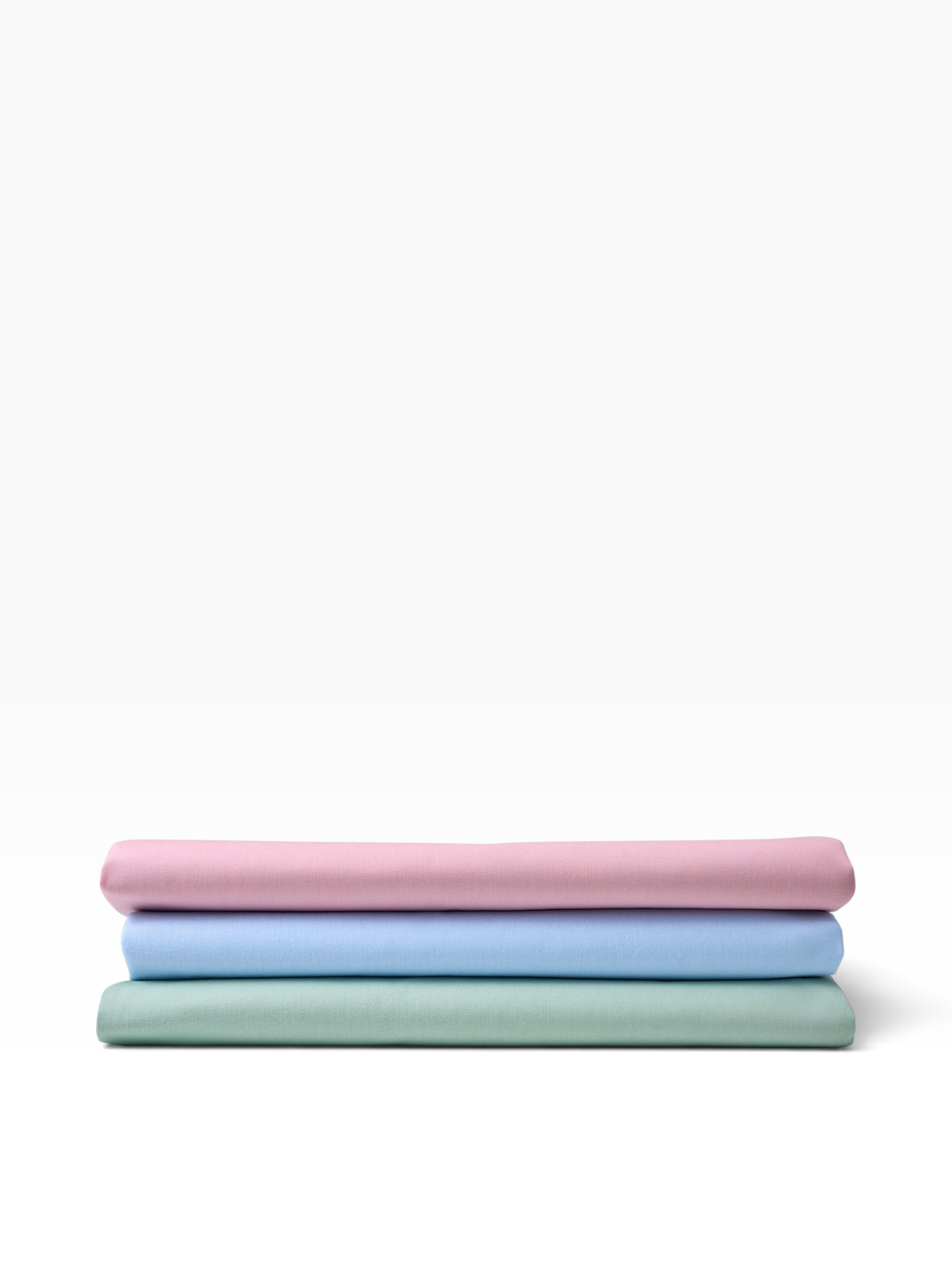 Valiant Products Val Cale 180 thread count cotton-polyester flat sheets in rose, light blue, and seafoam green.