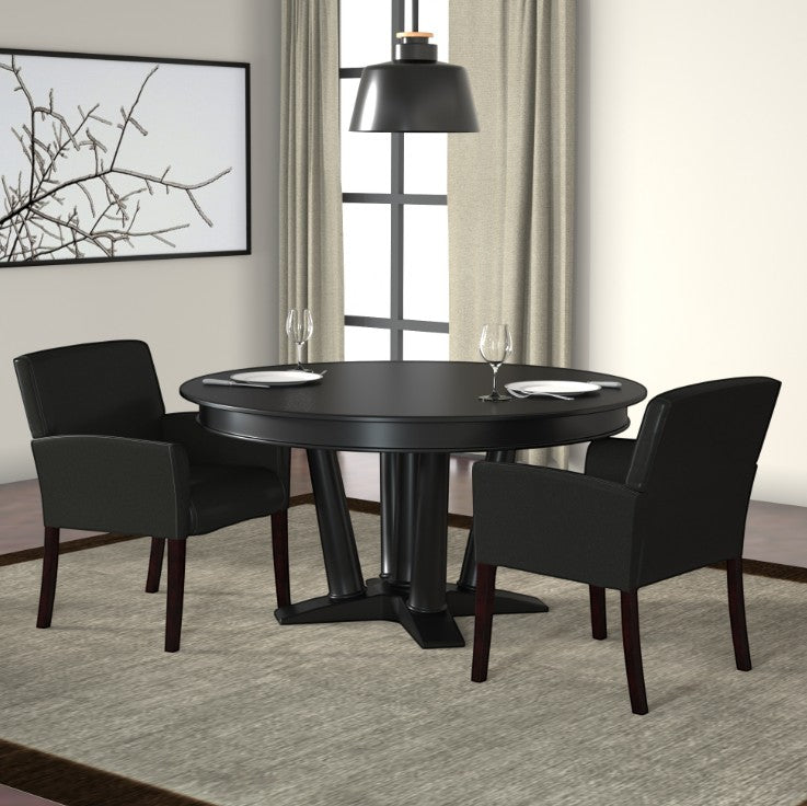 Valiant Products Perrin guest chairs in black vinyl with mahogany legs arranged around a round black dining table.