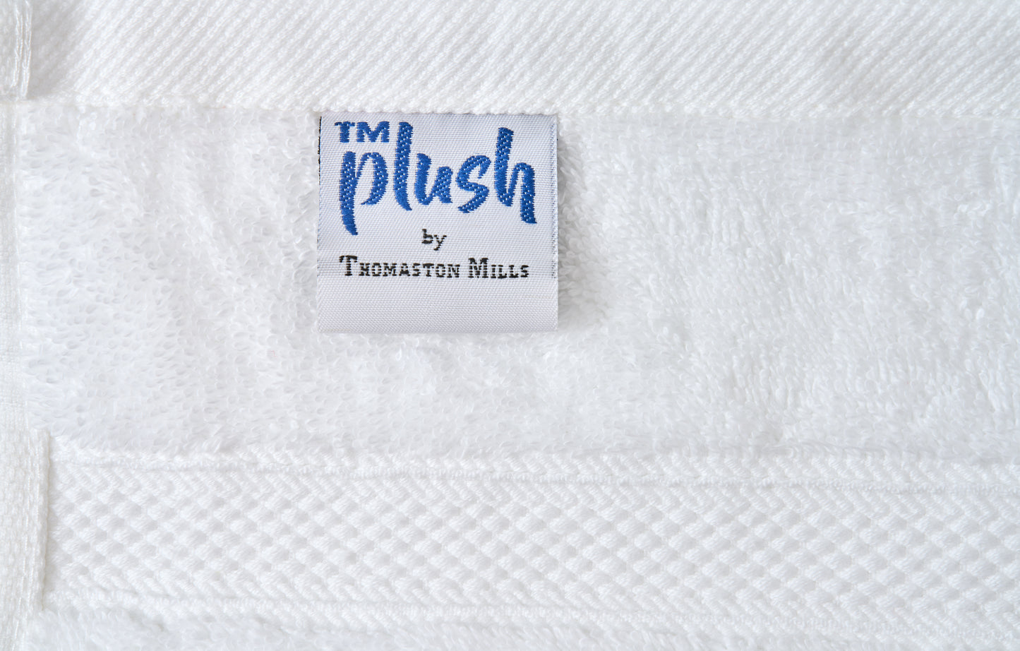 Valiant Products white plush cotton bath mat with textured dobby border and Thomaston Mills brand label