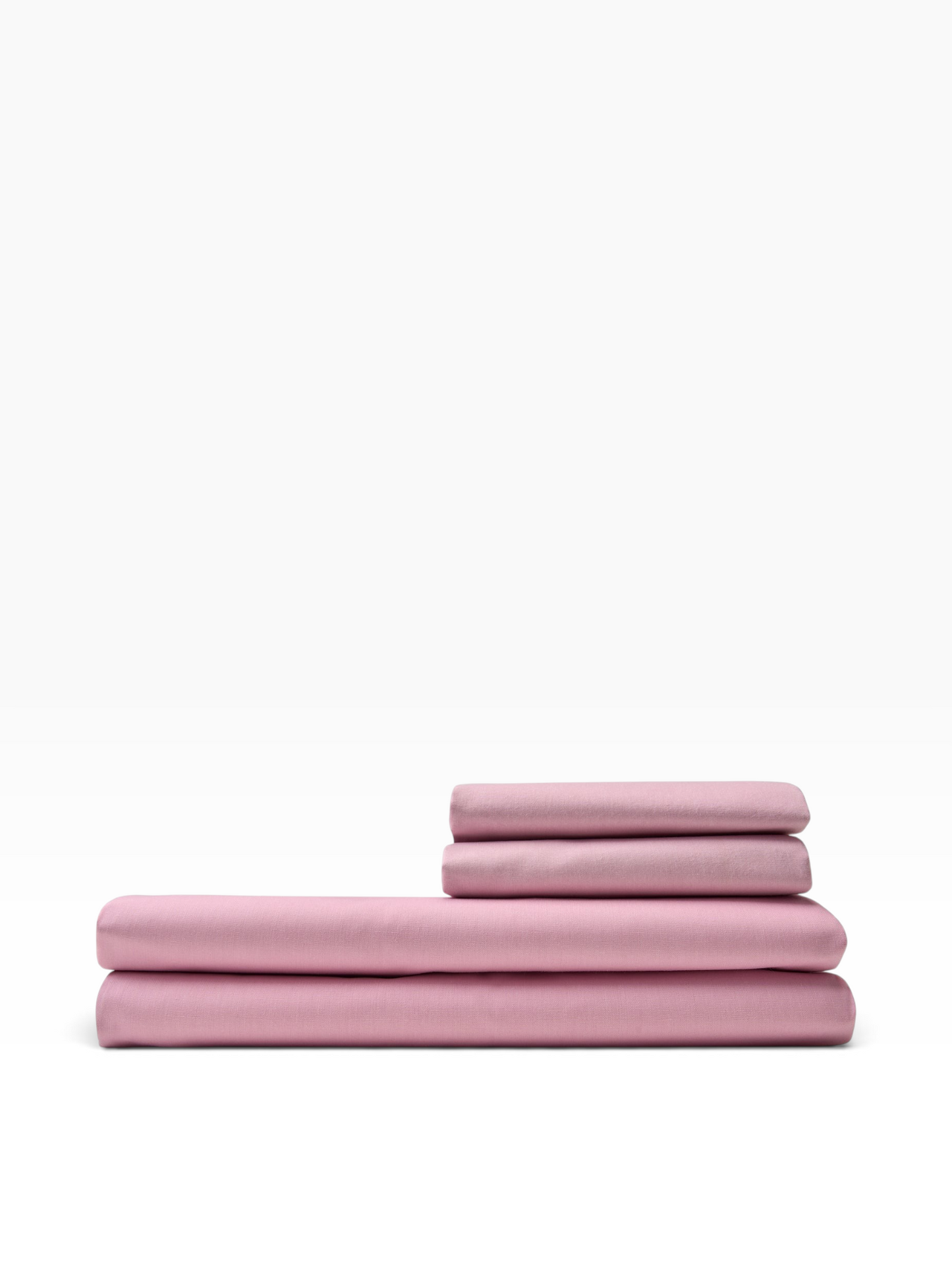 Valiant Products rose pink T-180 thread count flat sheets folded in a stack, made from a durable cotton-polyester blend.