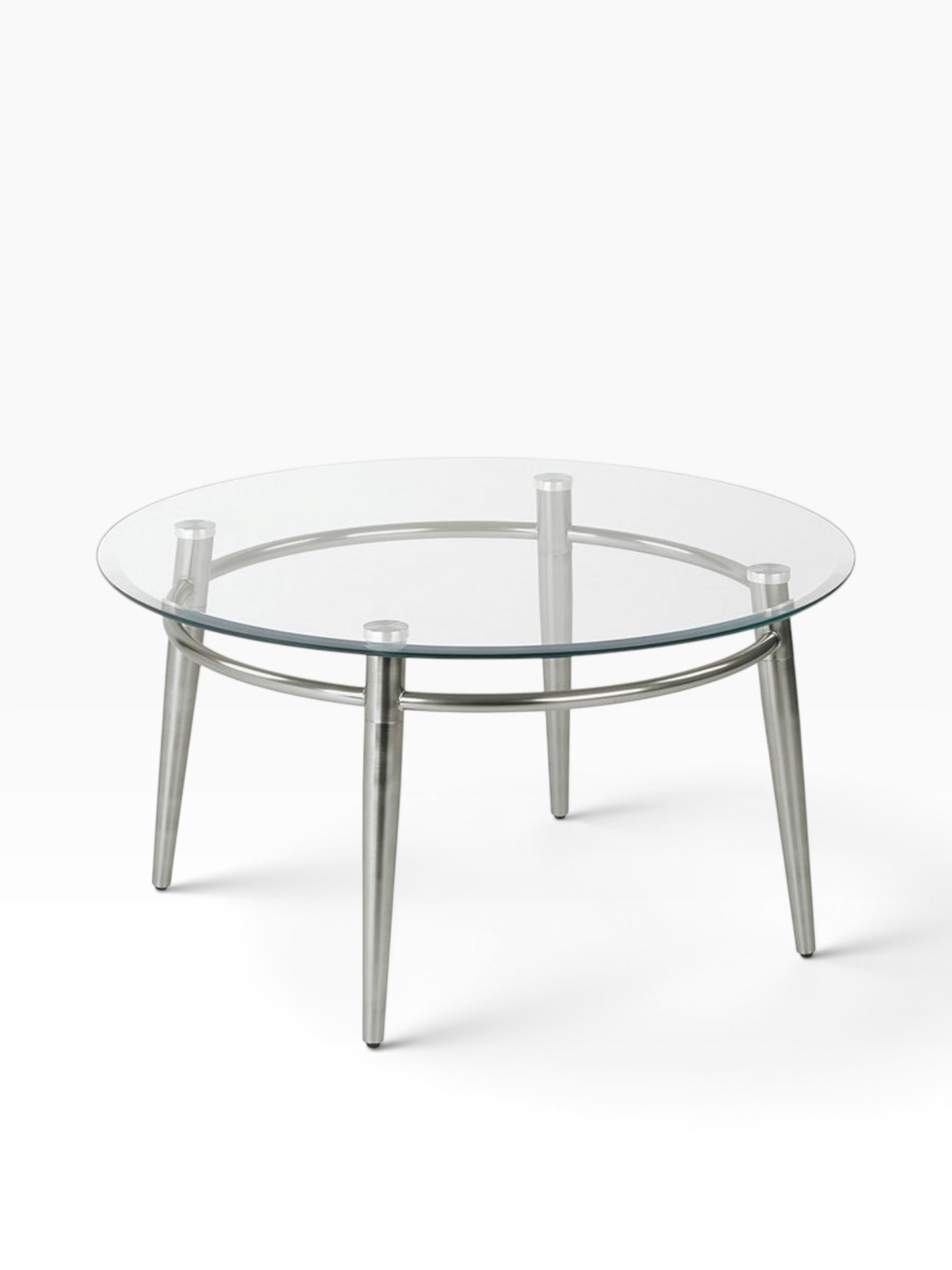 Valiant Products Brooklyn round coffee table with a clear glass top and brushed nickel metal legs on white background