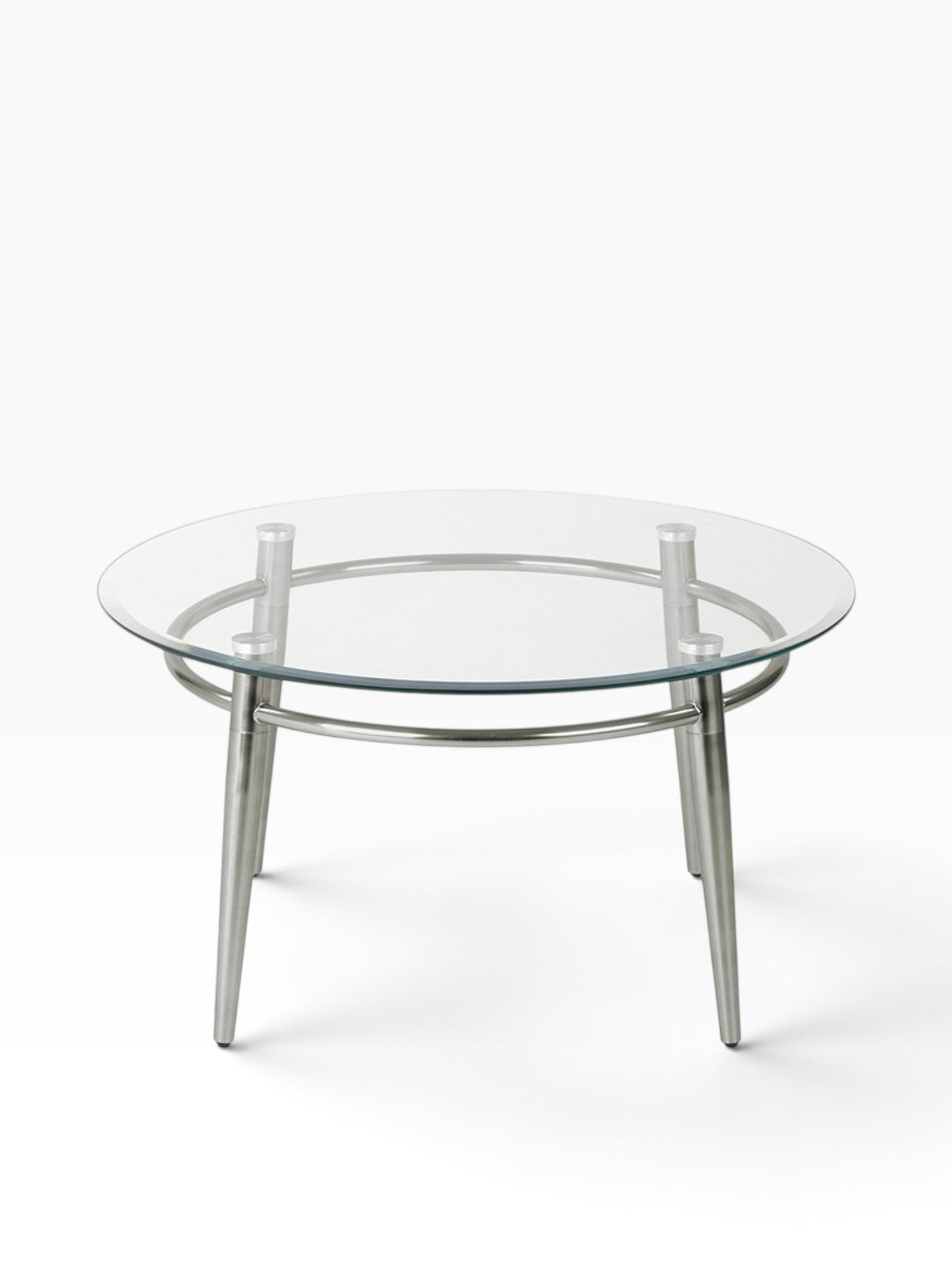 Valiant Products Brooklyn round coffee table with a clear glass top and brushed nickel metal legs