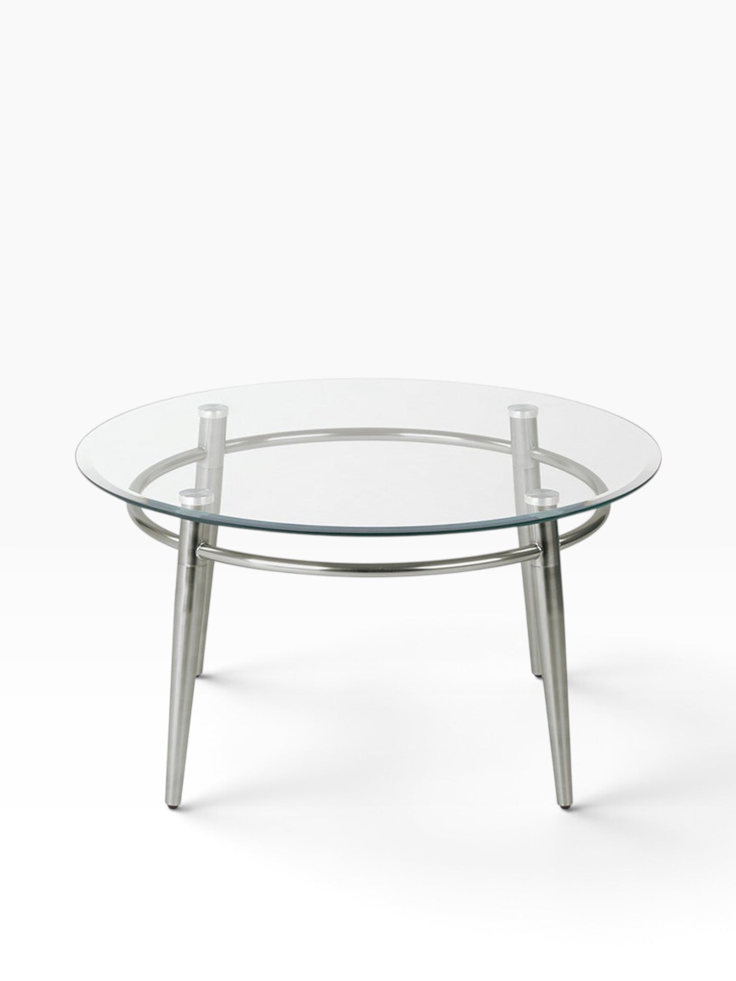 Valiant Products Brooklyn round coffee table with a clear glass top and brushed nickel metal legs