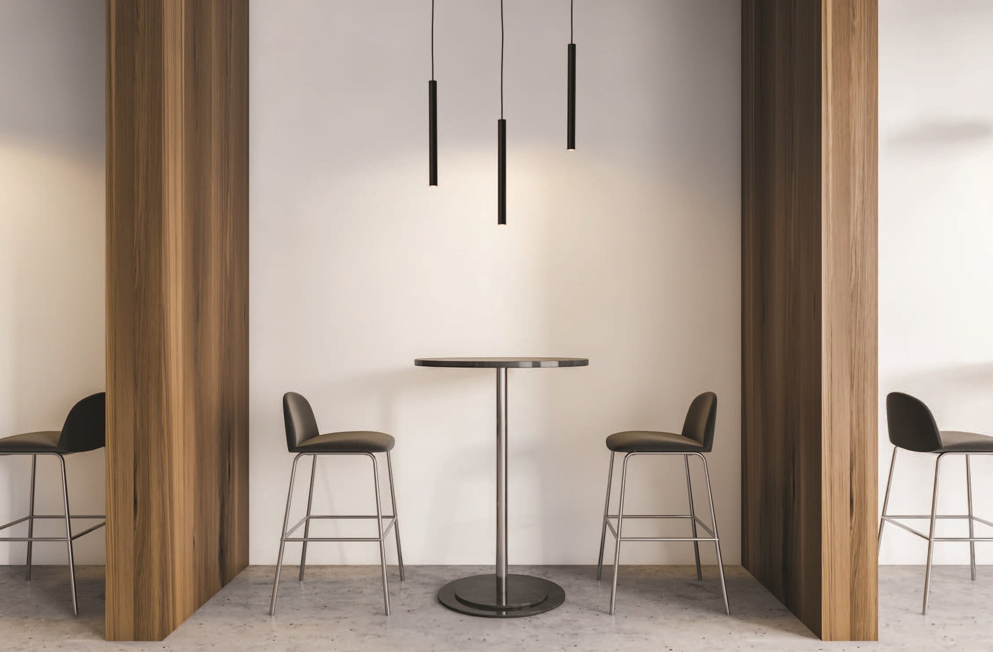 Valiant Products Satori matte black LED pendant lights hanging over a modern bistro table with bar stools