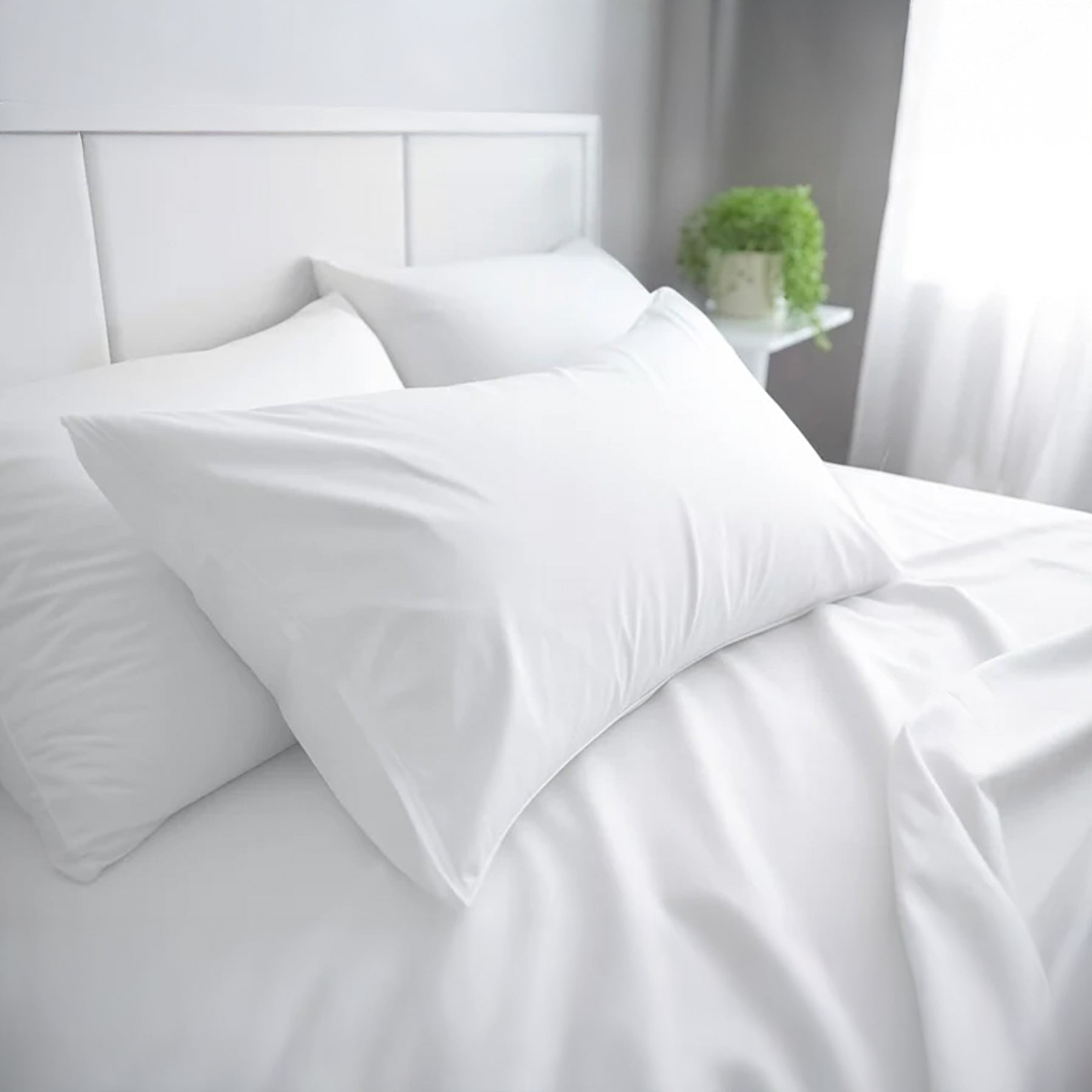 Valiant Products Simplicity 180 thread count white cotton-polyester percale flat sheet on a made bed